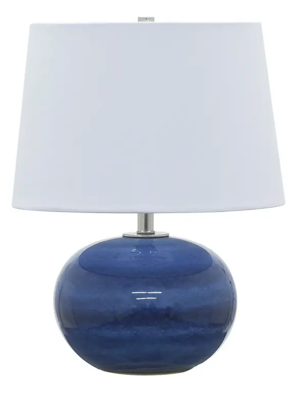 The Scatchard table lamp combines timeless stoneware craftsmanship with a vibrant blue gloss finish. At 17 inches tall, it's perfectly sized for bedside tables or accent surfaces, featuring a crisp white linen shade.