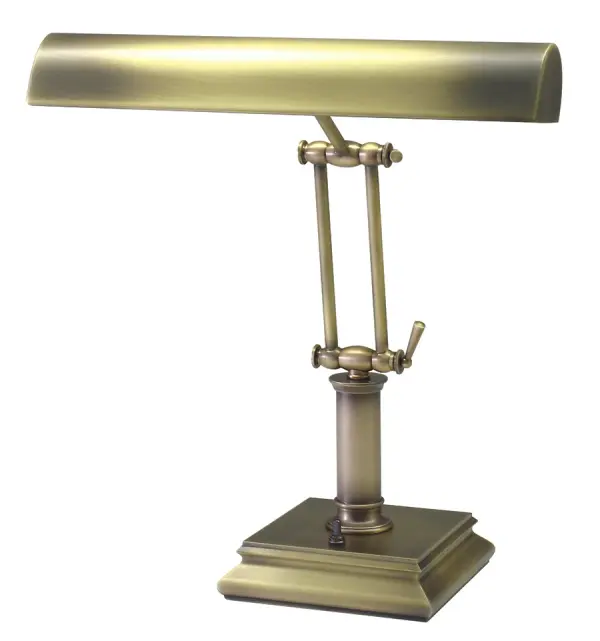 This traditional piano and desk lamp combines elegant antique brass styling with practical dual-bulb illumination. The 14-inch design provides focused task lighting ideal for reading, working, or piano playing.