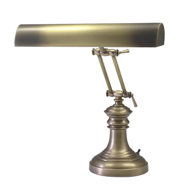 This 14-inch piano and desk lamp combines traditional styling with practical dual-bulb illumination. The antique brass finish and metal shade deliver warm, focused task lighting ideal for reading, working, or piano playing.