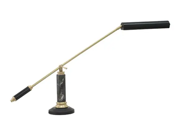 This sophisticated piano and desk lamp combines polished brass with black marble for a luxurious aesthetic. The counterbalance design allows precise positioning, while integrated LED technology provides energy-efficient, focused illumination.