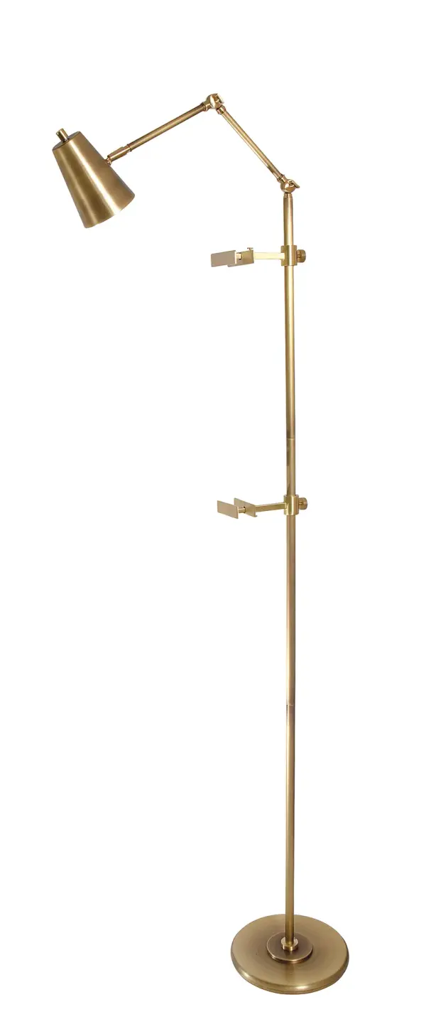 The River North Easel Floor Lamp combines industrial-inspired design with contemporary elegance. Its adjustable spotlight shade and mixed brass finishes create a versatile task lighting solution perfect for reading or focused work.
