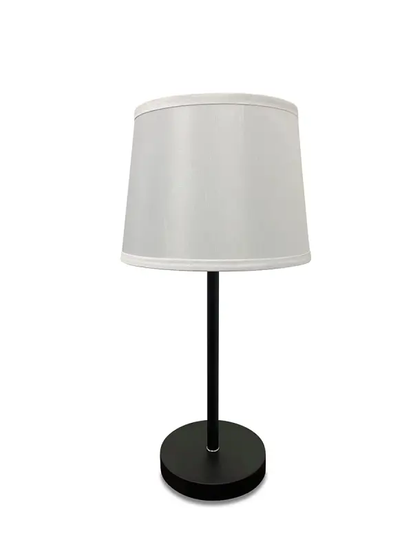 The Sawyer table lamp combines contemporary style with practical functionality. Its black and satin nickel finish offers sophisticated contrast, while the built-in USB port adds modern convenience for charging devices.