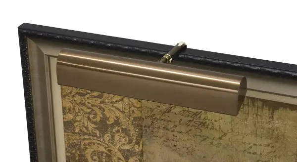 An 18-inch traditional picture light in statuary bronze finish, designed to highlight artwork and framed pieces. Plug-in convenience with California Title 24 compliance makes installation straightforward.