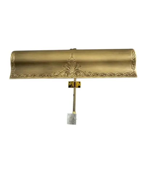 The Olivia picture light combines traditional styling with practical functionality. Its 12-inch width suits medium artwork, while the hi-lo switch offers lighting control. The antique brass finish adds warmth to any space.