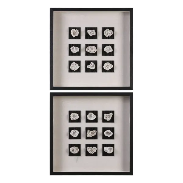 A framed display of authentic geode stones on linen matting, set in a black fir wood shadow box. Adds organic texture and dimension to any wall.