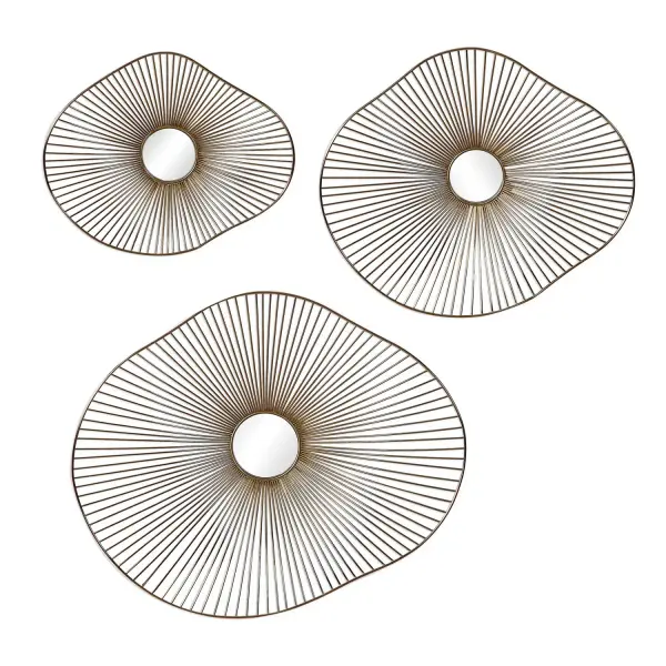 A three-piece metal wall art set with organic curved forms, radiating spokes, and mirrored centers in a plated gold finish. Adds sculptural interest to any wall.