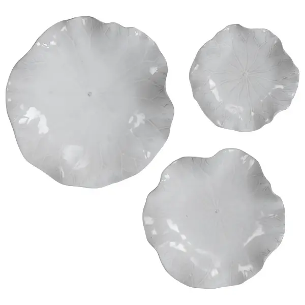 A set of three graduated ceramic flowers with detailed veining in a fresh white glaze. Versatile as wall art or tabletop decor, and rated for indoor/outdoor use.