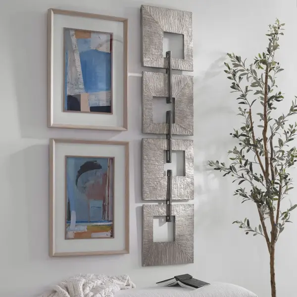 A striking ridged metal wall panel in champagne gold, joined by aged silver iron bars. Versatile orientation and dramatic scale make it a strong statement piece for entries or living spaces.