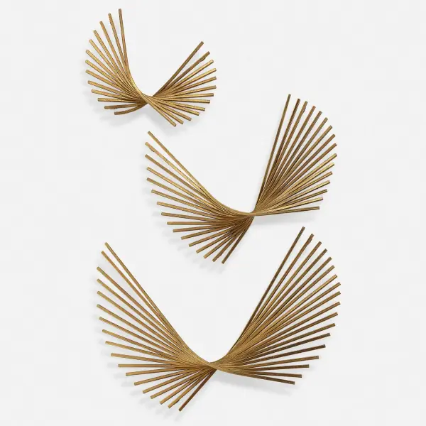 A three-piece set of abstract iron wall sculptures finished in antique gold leaf, designed to appear as floating wisps. Versatile hanging orientation adds flexibility for styling.