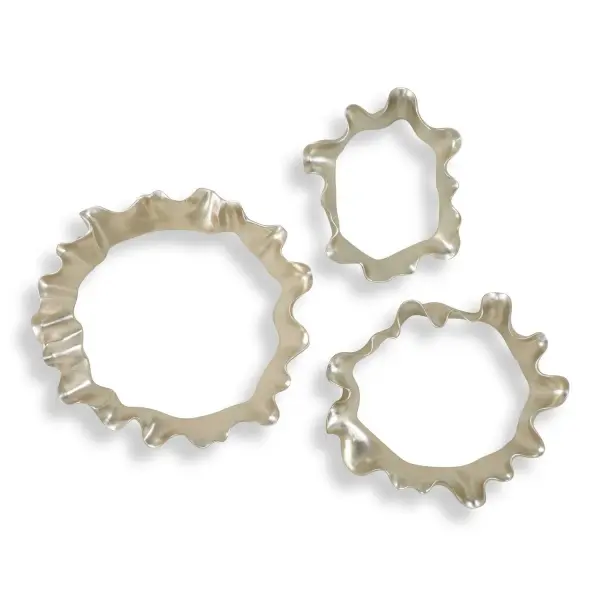 This three-piece resin wall art set uses undulating silver leaf forms to mimic water ripples, adding organic texture and dimension to living spaces and entryways.
