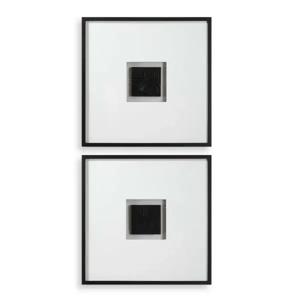 A set of two dark bronze finished shadow boxes with sculptural relief elements, framed in satin black with oversized linen matting for a gallery-like presentation.
