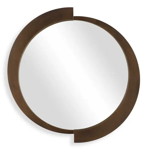 The Reverse Round Mirror Features A Three-dimensional Iron Frame Finished In A Brushed Bronze With Champagne Undertones. Its Modern Design And Timeless Finish Make It A Striking Accent Piece. Collection: Reverse Designer: Grace Feyock Finish: Brushed Bronze Width: 43.75" Height: 44.50" Length: 2.13" Weight: 28.00 lb Extension from Wall: 2.13" Material: Iron, Mirror, Mdf Country of Origin: China Safety Rating: Indoor Only