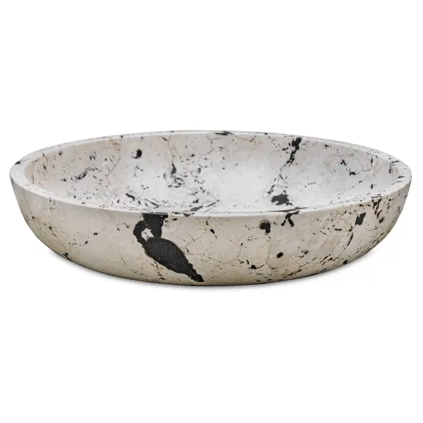 A handcrafted natural white stone bowl with black resin accents, blending modern art-inspired lines with artisanal texture. Versatile for indoor or covered outdoor display.
