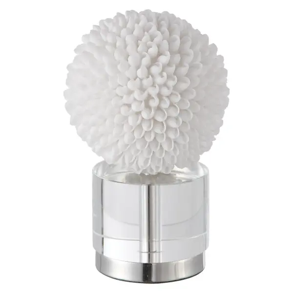 This tabletop sculpture pairs faux sea shell texture with polished nickel plating and a crystal base, adding coastal texture to shelves or console tables.