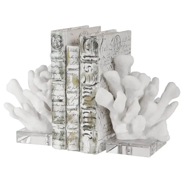 A decorative set of two faux coral bookends on crystal-look bases, blending coastal texture with a bit of sparkle for shelves and desks.