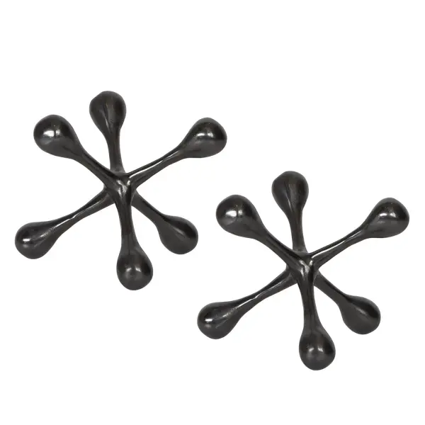 A compact pair of cast aluminum decorative objects in black nickel, ideal for adding subtle sculptural interest to shelves and tabletops.