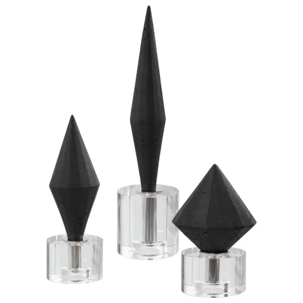 A set of three faceted black stone diamond sculptures on crystal bases, bringing polished, jewel-like accent pieces to shelves, tables, or mantels.