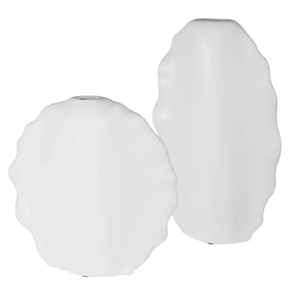 This set of two ceramic vases features artistic ruffled edges and a clean matte white finish, versatile enough for indoor or covered outdoor display.
