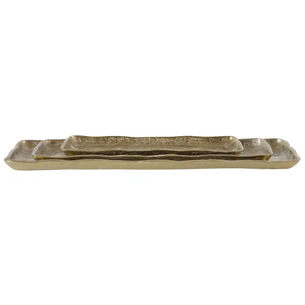 A set of three organic-edge cast aluminum trays in a heavily textured antique gold finish, offering versatile decorative styling across surfaces of varying scale.