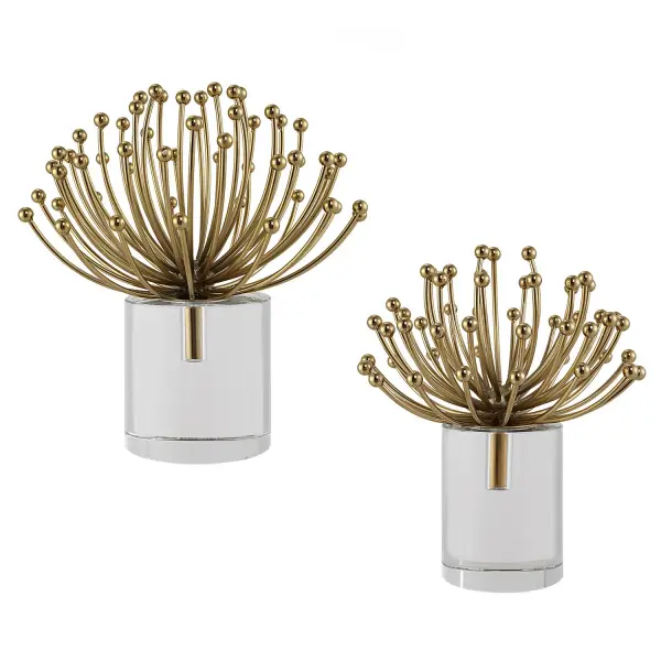 A set of two steel sculptures on crystal bases, offering an elegant contemporary accent for shelves, consoles, or desks.