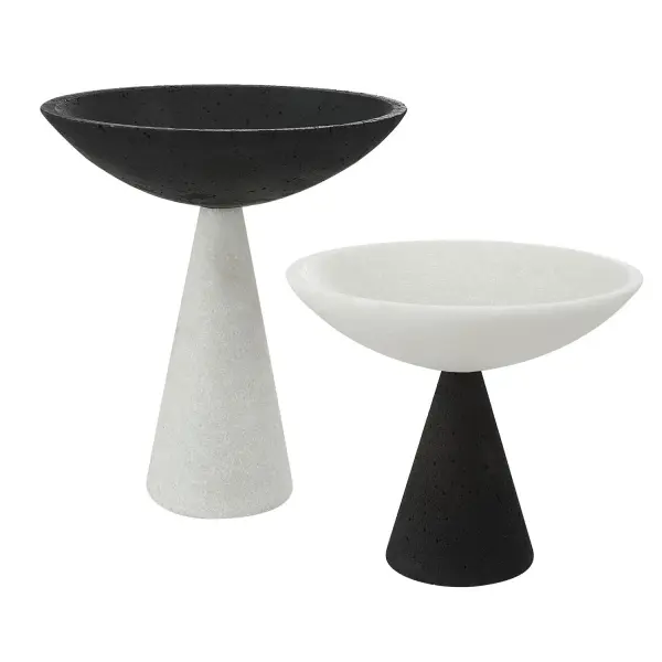 This set of two pedestal bowls brings bold black-and-white marble-inspired styling to any tabletop or shelf display.