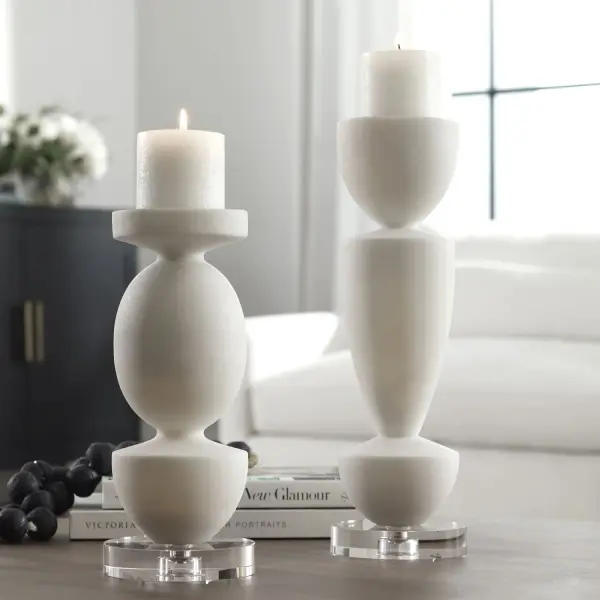 A refined set of two ivory stone-look candleholders with crystal accents, bringing understated luxury to tabletops, mantels, and console styling.