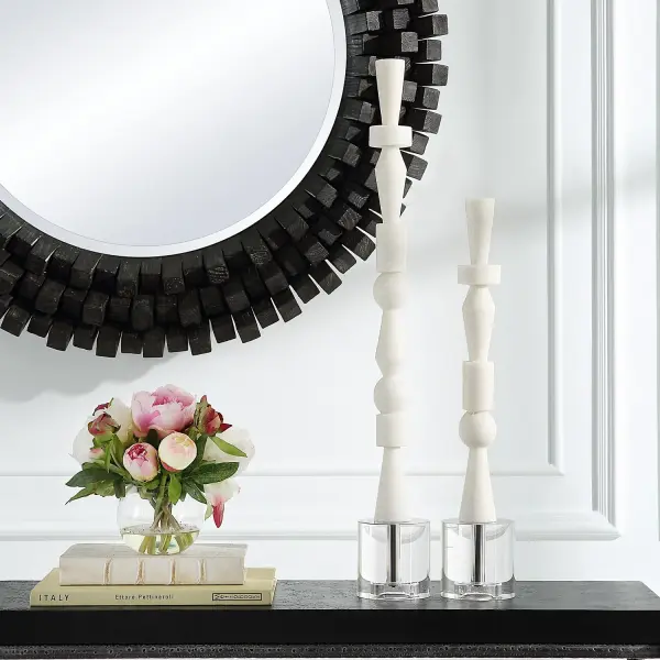 A set of two ivory-toned stacked totem sculptures with a faux-marble look and crystal foot detail, ideal for adding sculptural texture to a shelf or console.