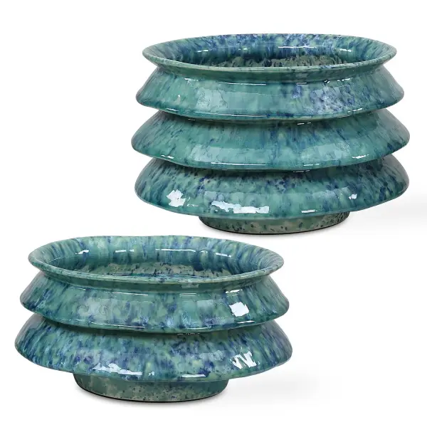 A charming set of two ceramic accent bowls with sculptural zigzag sides and a rich blue-green reactive glaze—versatile decorative pieces for shelves, tables, or entryways.