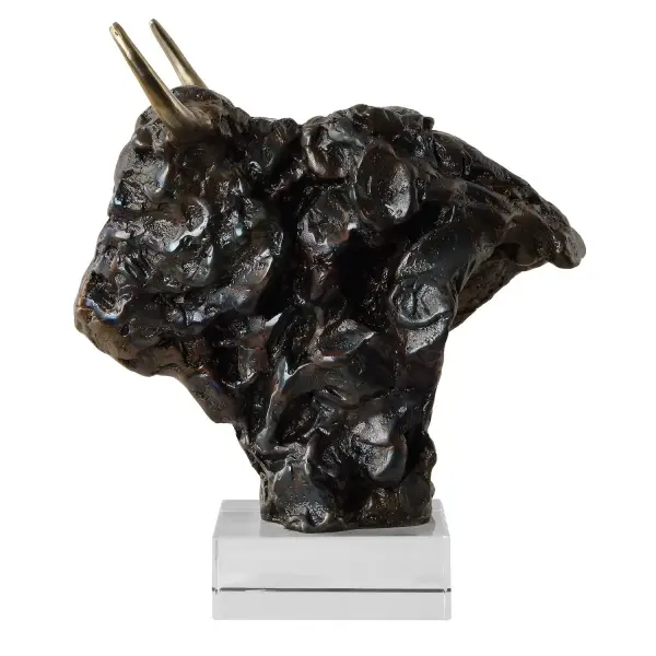 This cast iron bison bust in tarnished bronze with gold-tone antlers sits atop a crystal base, delivering a bold decorative statement for tabletops and shelving.