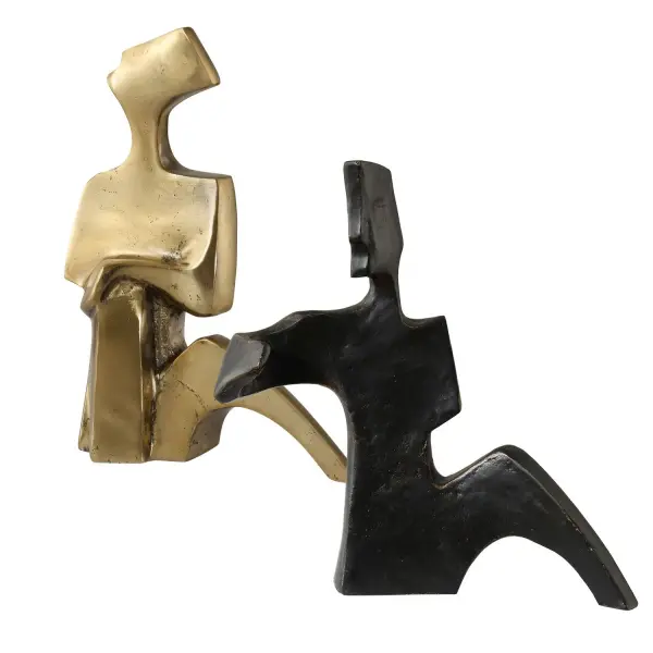 This tabletop sculpture set captures an embracing couple in warm bronze-and-gold cast iron, offering a romantic decorative accent for shelves, consoles, or mantels.