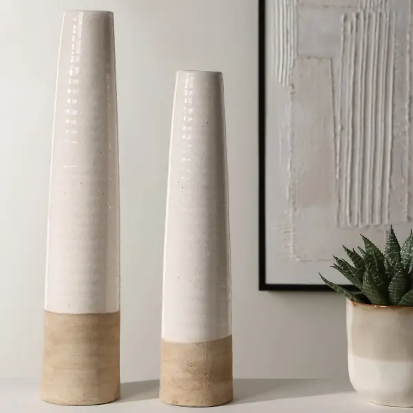 This crackled white ceramic vase pair blends sandy texture with a serene coastal look, ideal for styling shelves, consoles, or entry tables.