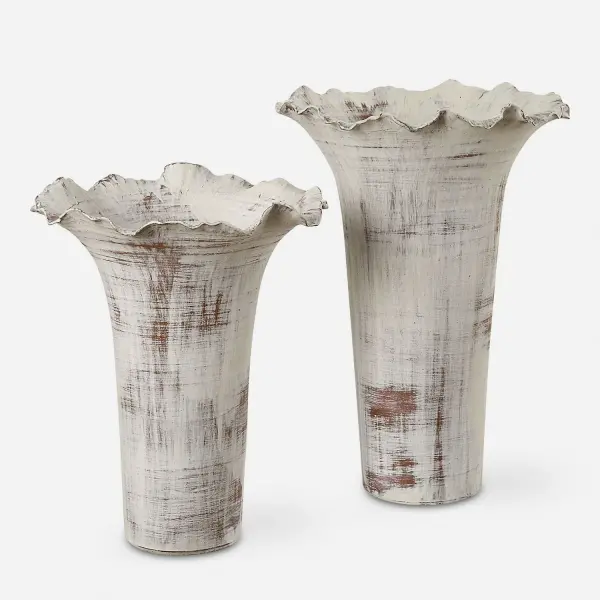 This porcelain vase set brings understated vintage charm with distressed white finish and rust brown undertones, ideal for layering decor on tables and shelves.
