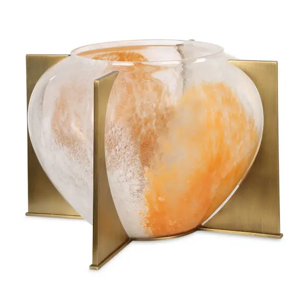 This amber-hued glass vase on a sleek brass stand adds a modern, gallery-like touch to shelves, tables, or entryways.