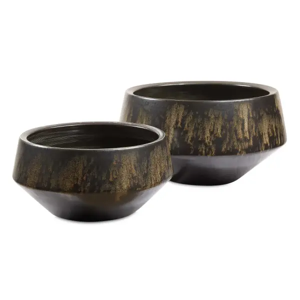 A handcrafted set of two bronze ceramic bowls with a greenish-ivory drip glaze, blending rustic texture with refined form for versatile tabletop styling.