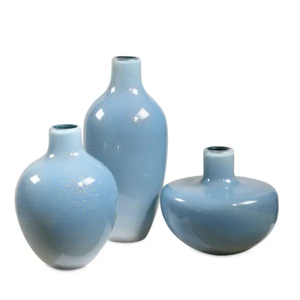 A set of three pale blue glass vases flecked with metallic specks, offering varied sizes for layered styling on tables, shelves, and mantels.