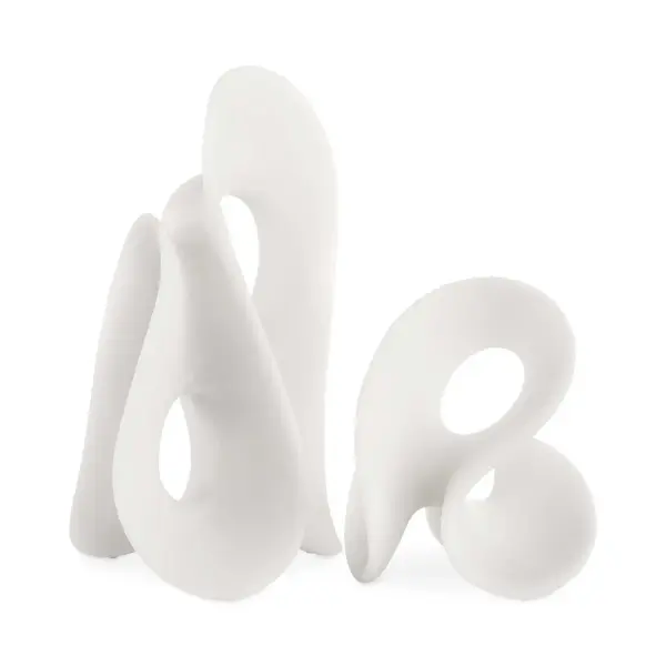 A pair of smooth, curved polyresin sculptures in matte white that mimic Thassos marble. Versatile indoor/outdoor styling for modern spaces.