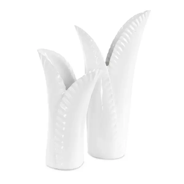 A set of two white ceramic vases with rippled, leaf-inspired edges. Understated and versatile for tabletop or shelf styling in nearly any room.