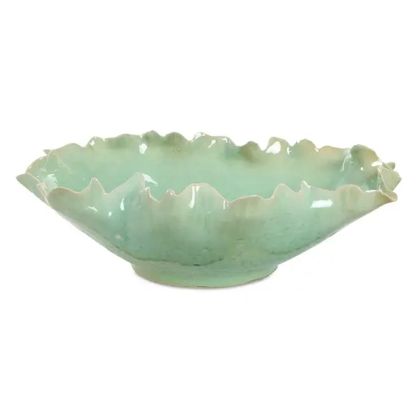 This green-glazed ceramic bowl brings a soft, ruffled silhouette and crackle texture to tabletops, working equally well as decor or a functional centerpiece.