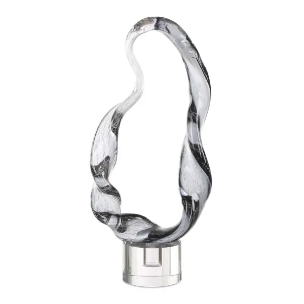This smoked glass sculpture on a crystal base brings organic, modern sophistication to shelves, consoles, or tabletops as a refined statement accent.