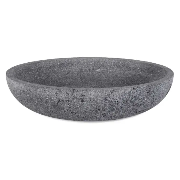 This textured gray lava stone bowl offers a minimalist, organic accent piece suitable for indoor or outdoor decorative display.