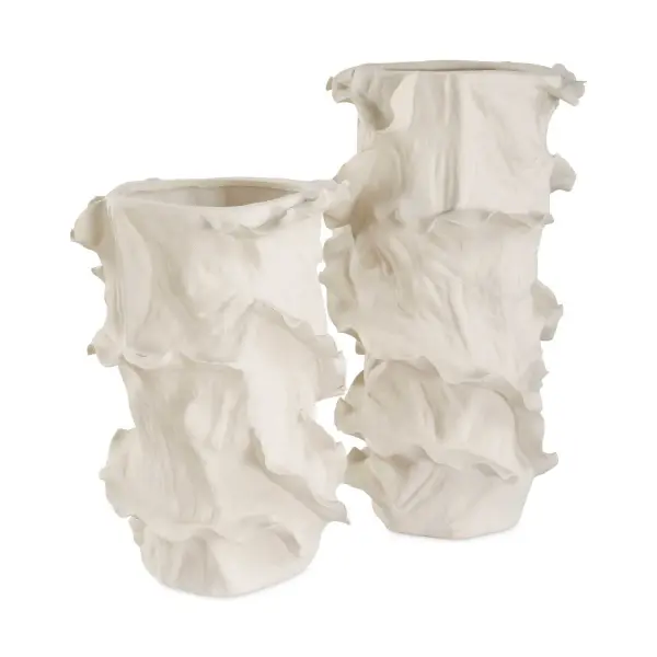 A set of two ceramic vases with ruffled, organic edges in a clean white finish—an easy way to add sculptural interest to shelves, tables, or entryways.