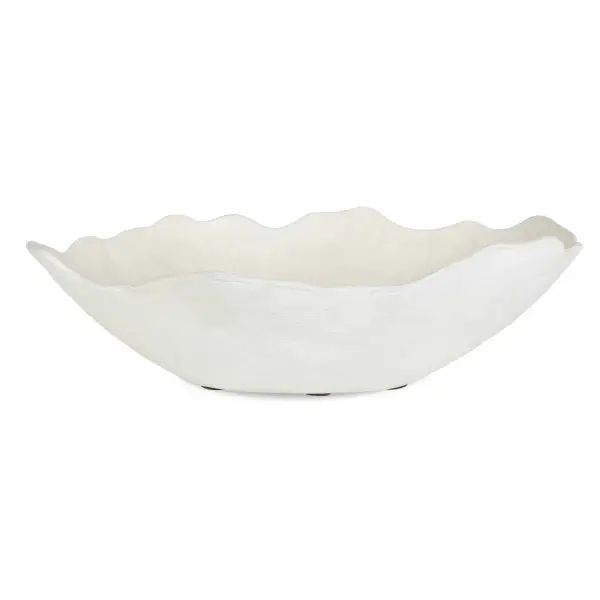 A hand-hammered cast aluminum bowl with organic wavy edges and a warm white finish, versatile enough for tabletop or wall display indoors or out.