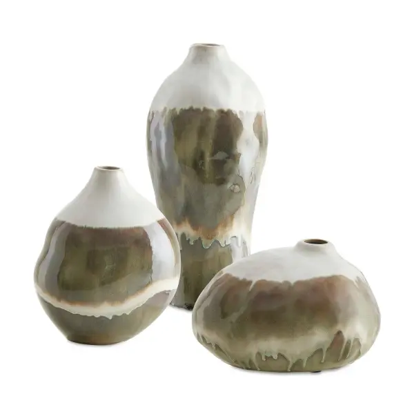 A set of three organic-shaped ceramic vases with a smooth glazed finish blending earthy tones into soft ivory, versatile for indoor and outdoor decor.