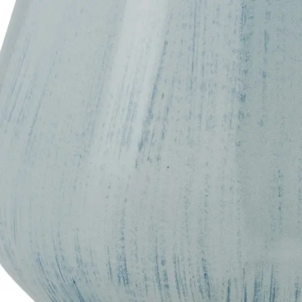 This powder blue ceramic vase brings sculptural, coastal-inspired style with a hand-brushed glaze finish and versatile indoor/outdoor rating.