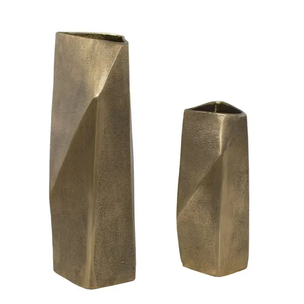 A cast aluminum set of two asymmetrical, faceted vases in an antique brass finish with dark bronze undertones. Versatile decor for tabletops, mantels, or patios.
