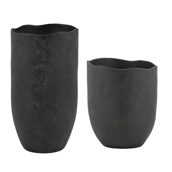 A set of two organically shaped earthenware vases with a rich, rustic matte black glaze and waved rim detail, suitable for indoor or covered outdoor display.