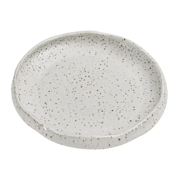 A hand-finished earthenware bowl with a waved rim and speckled creamy white glaze, suited for indoor or covered outdoor display as a decorative accent.