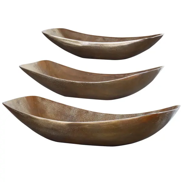 This set of three cast aluminum bowls in a textured antique brass finish offers versatile decorative styling for tables, shelves, and console surfaces.