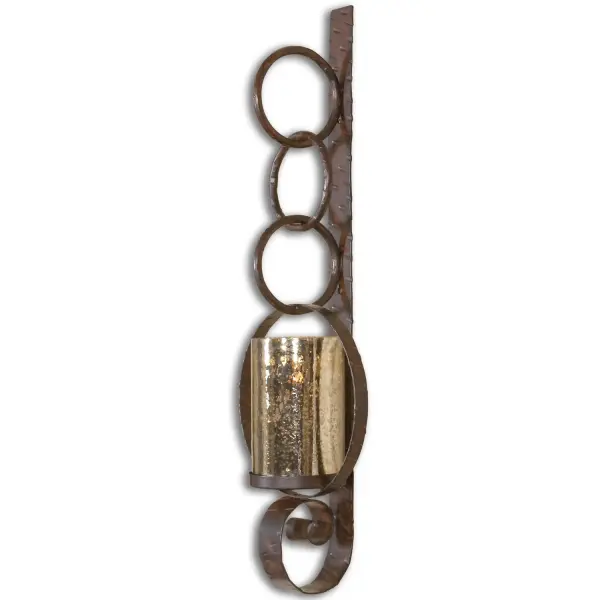 A distressed iron wall sconce with an antiqued mercury glass hurricane and included candle, bringing old-world warmth to entryways and living spaces.