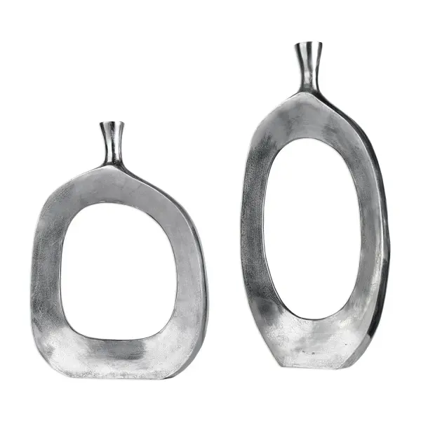 This cast aluminum vase set brings oversized, sculptural presence to any room with a handcrafted textured nickel finish that catches light beautifully.